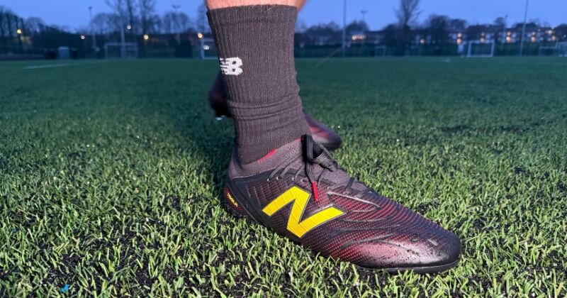 new balance tekela footall boots in black and red